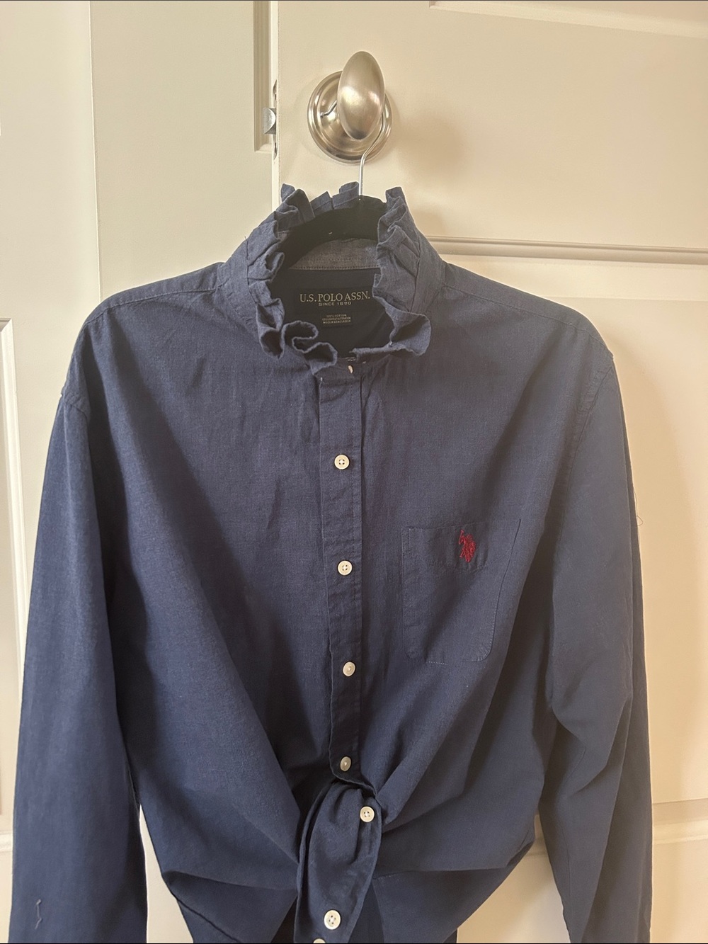 U.S. Polo Assn. Navy Long-Sleeve Shirt with Red Logo with ruffled collar.
